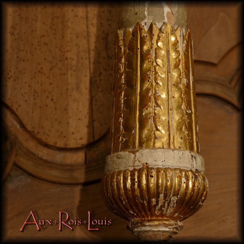 Gilding on the palmettes and gadroons of the candle stick