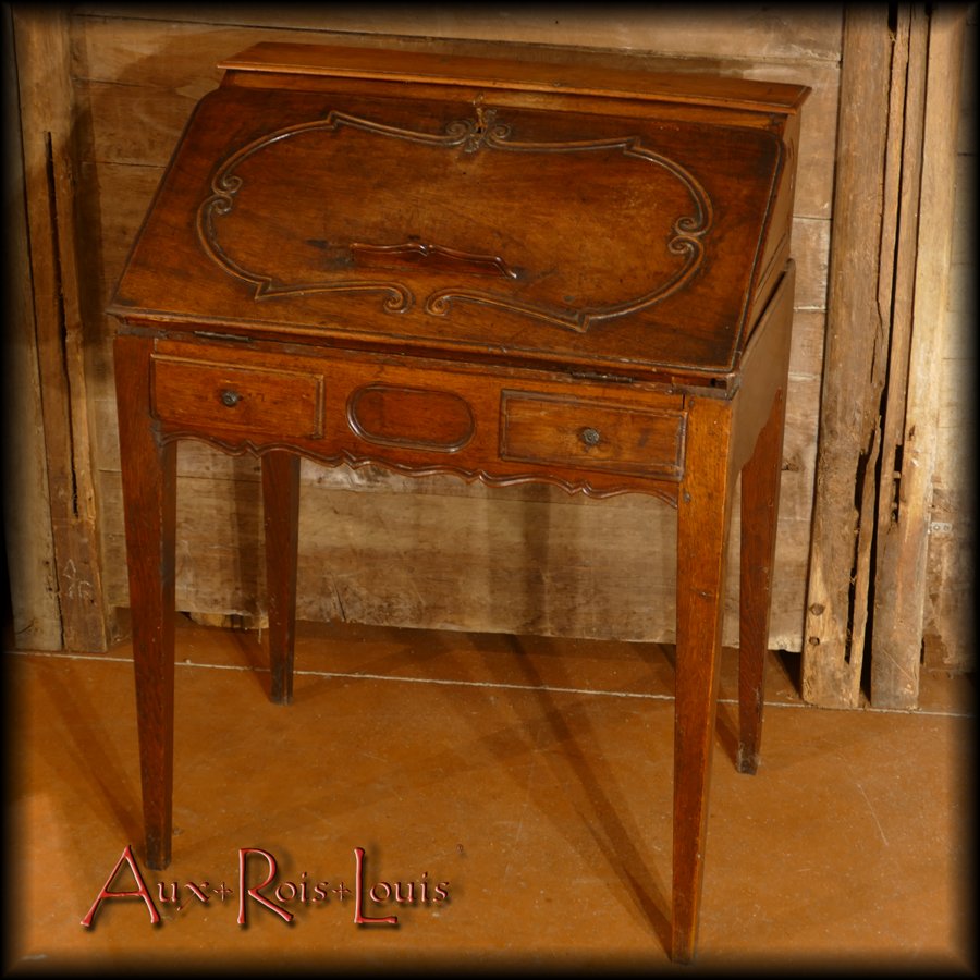 This Bureau de Dame has an inclined flap with a book rack and two 'official' drawers.