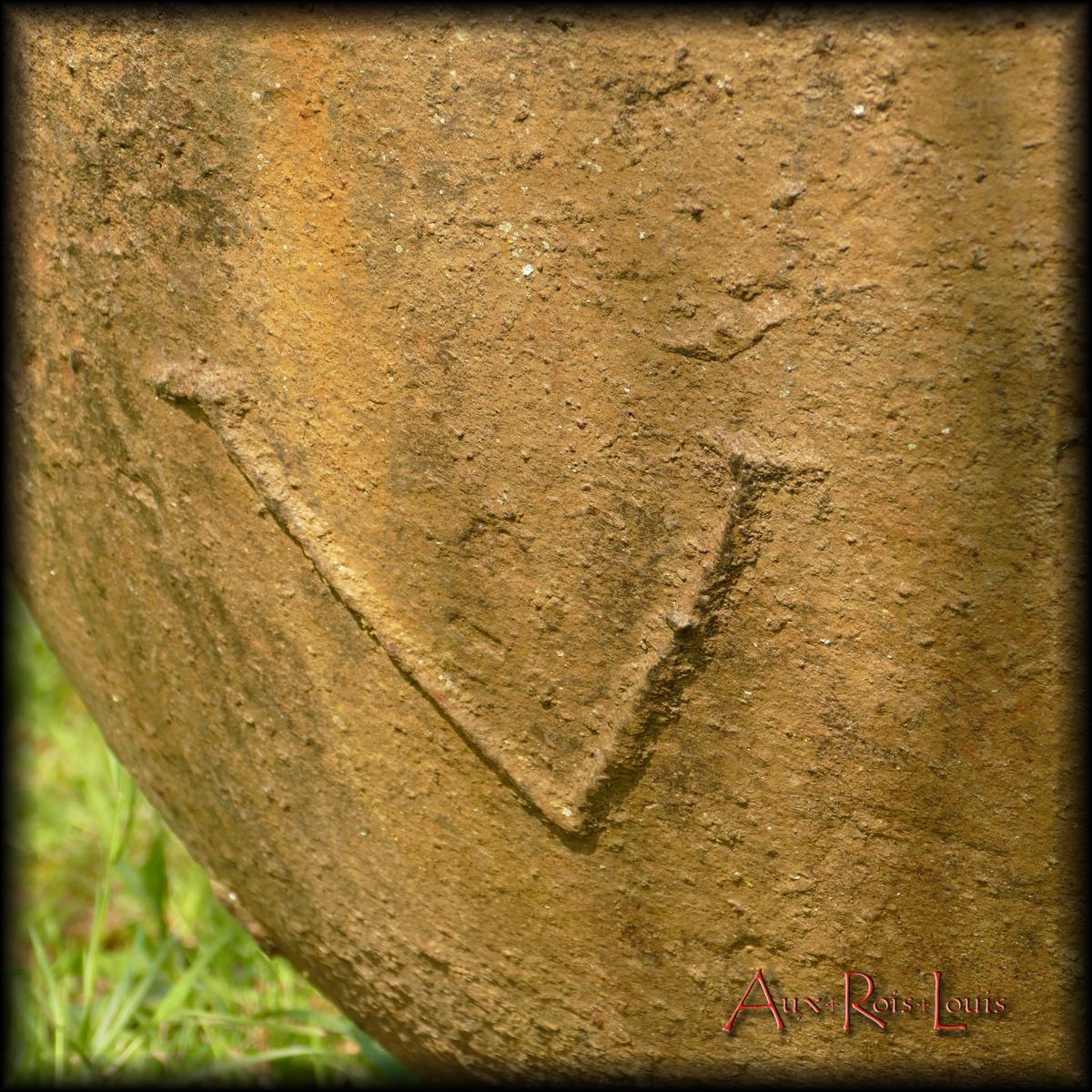 On its side the mark of a V, the signature of the master blacksmith who cast it