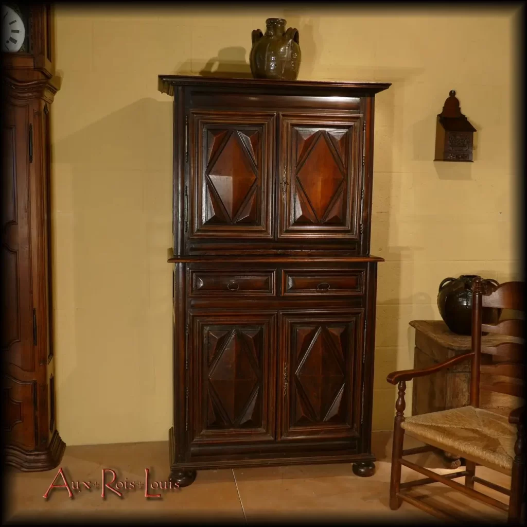 Small two-piece sideboard made in the 18th century in the South West of France. It has a cornice, a picture rail and two largely molded drawers, four doors decorated with diamond points and it rests on two straight feet at the back and two onion feet at the front.