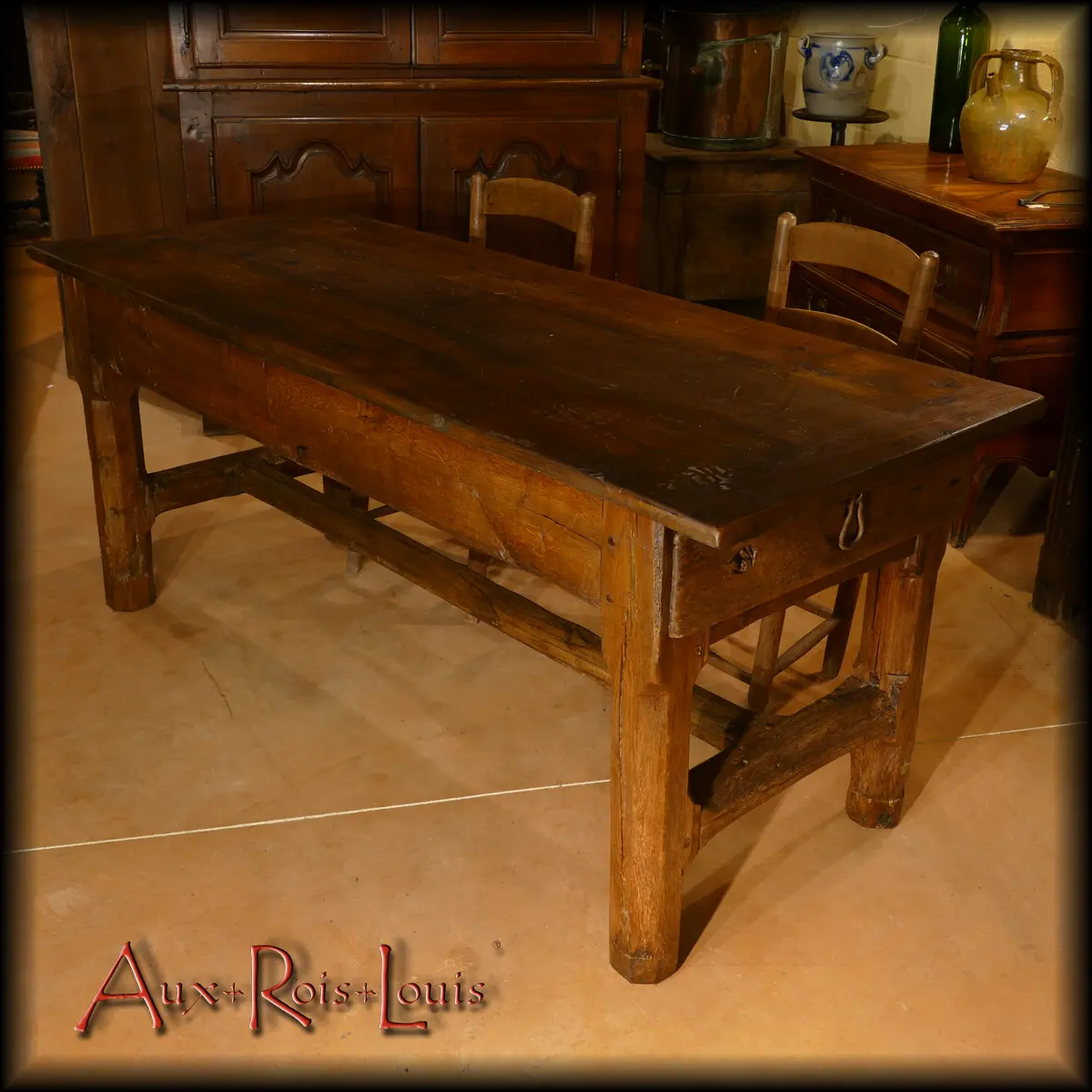 The cat bar on this Auvergne farmhouse table is notoriously raised and plush.